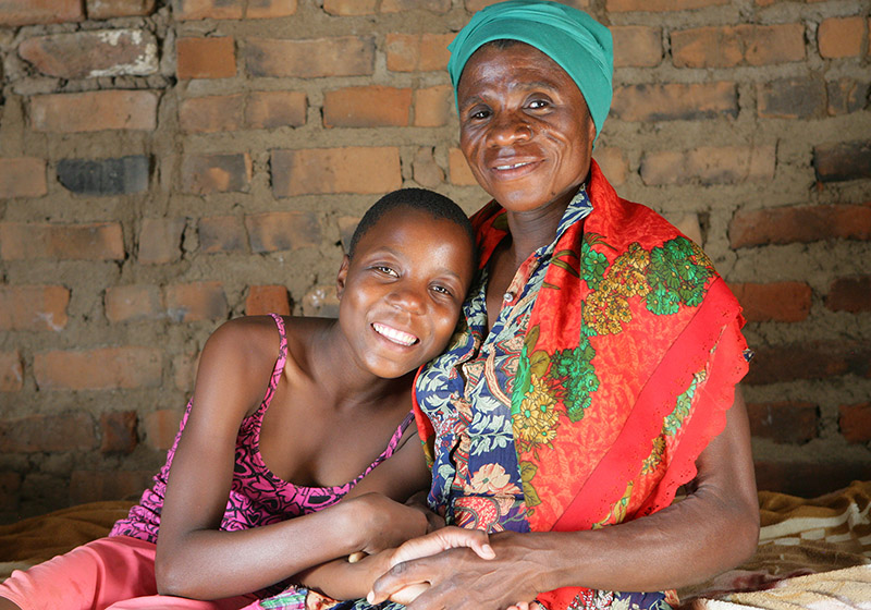 An HIV-positive woman and her granddaughter near Zimbabwe.